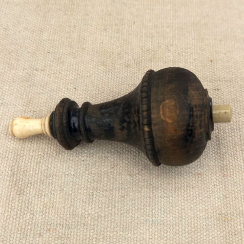 Antique wood British Butler bell push with vintage wooden surround and traditional brass push button.