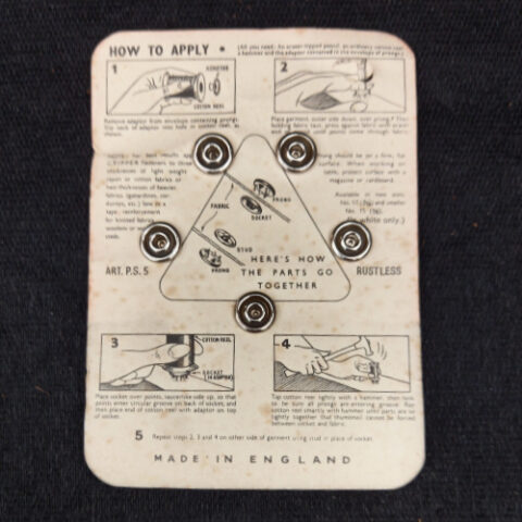 Vintage Newey's Gripper 12mm snap fasteners with five fasteners attached to the original retail packet.