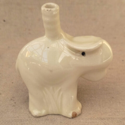 Vintage Nutbrown ceramic elephant pie funnel with a small chip on the right front foot.