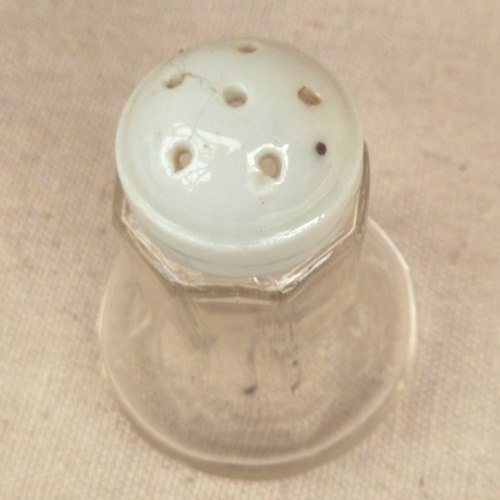 Vintage clear glass salt shaker with a ceramic lid