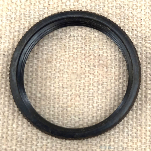 Vintage Bakelite replacement ring for restoring antique lamp sockets.
