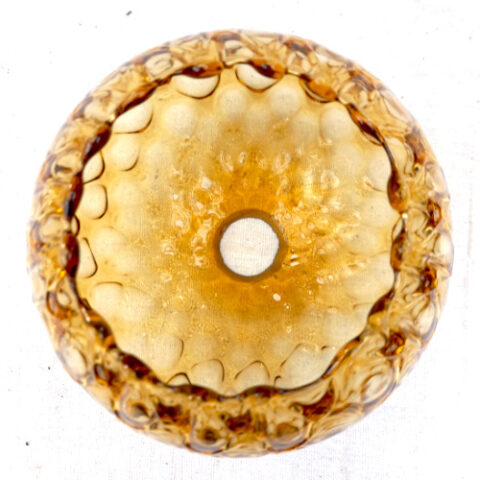 Retro globe pendant light shade made from textured amber glass with a warm vintage finish.