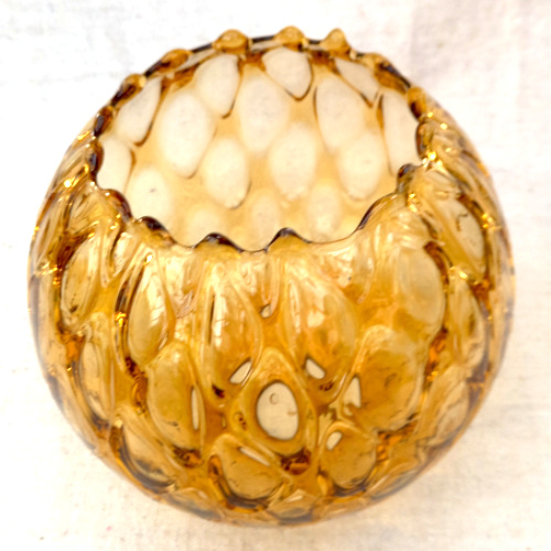 Retro globe pendant light shade made from textured amber glass with a warm vintage finish.