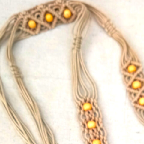 Authentic 1970s hand-knotted macramé belt in natural fiber with vintage bohemian styling.