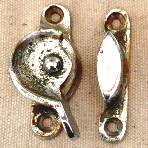 Metal window sash lock and keeper for timber sash windows.