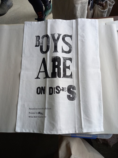 Custom printed tea towel showcasing a creative design made at Willow Bank Heritage Village.