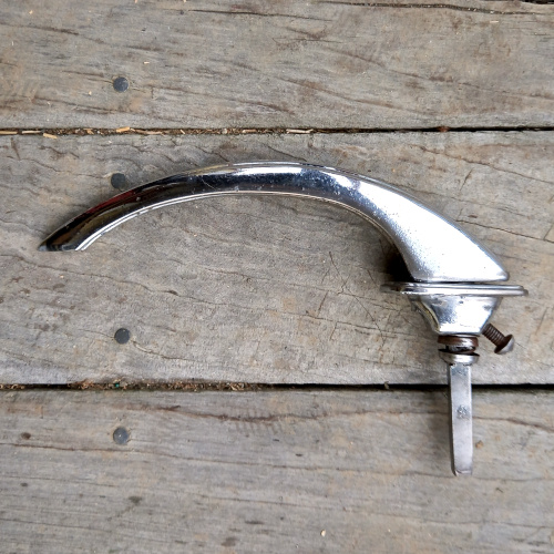 Vintage chrome automotive exterior door handle marked Industria Argentina