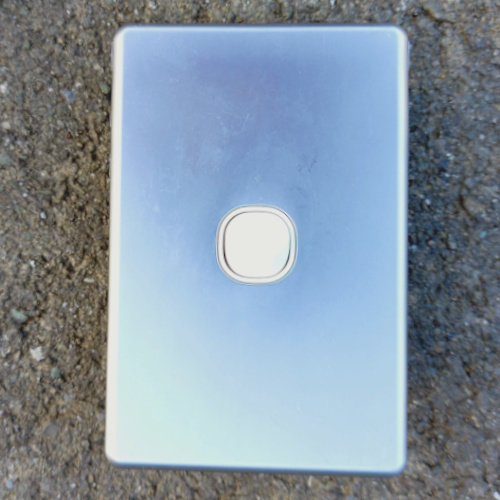 Clipsal C2000 Series 250V 10A flush switch with silver cover