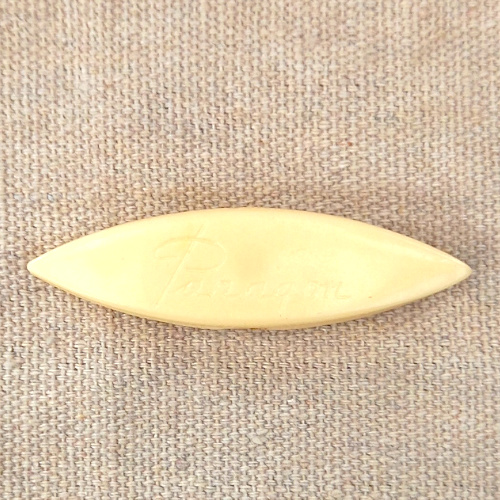 Cream-coloured vintage Paragon tatting shuttle with Paragon engraved on both sides
