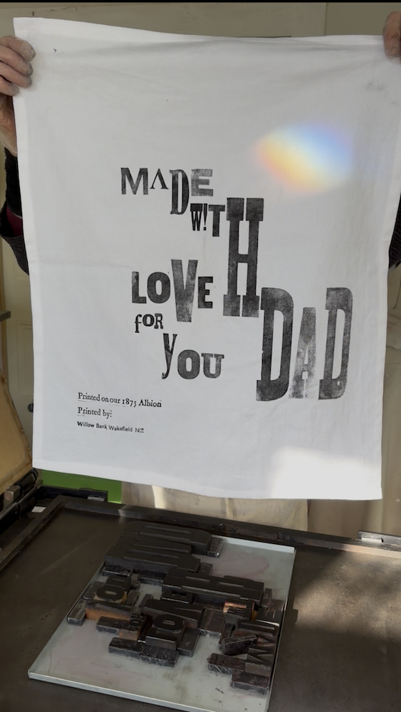 Father’s Day tea towel featuring the message “Made with love for you Dad,” printed using traditional wooden type.