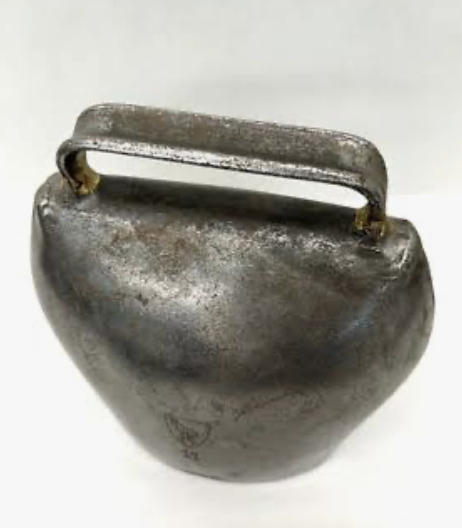 Traditional Swiss Trychel cowbells displayed at Willow Bank Heritage Village