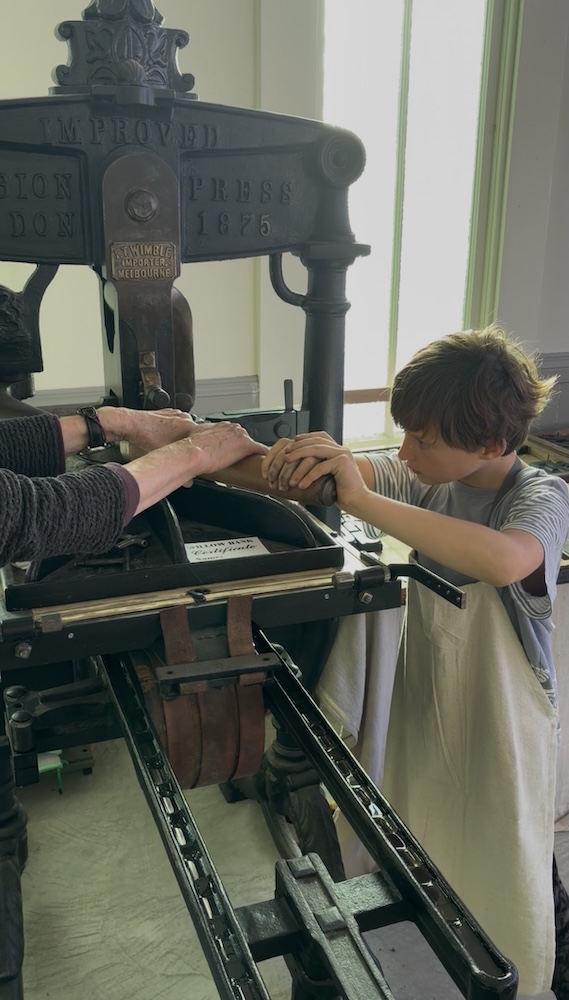 Printing experience using the historic 1875 Albion Press at Willow Bank Heritage Village.