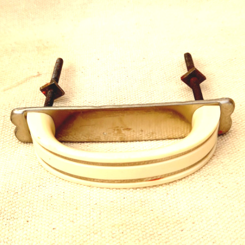 Art Deco ivory cream plastic drawer pull with chrome strip
