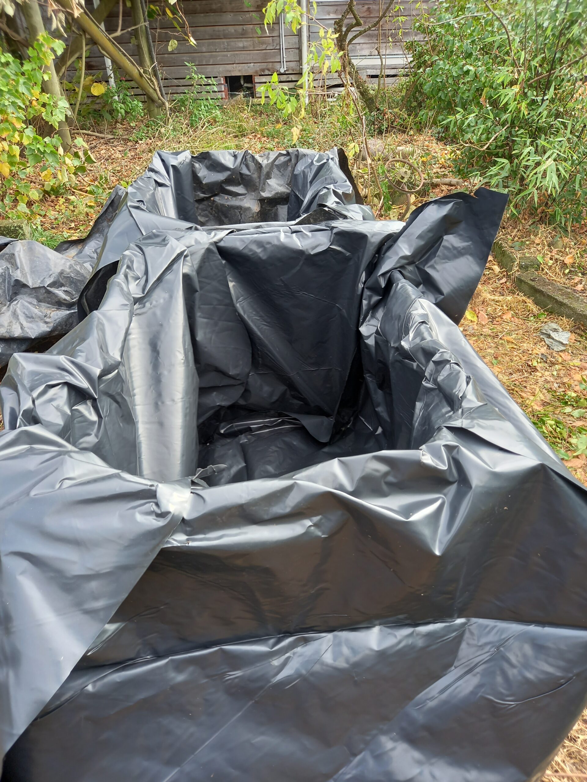 Plastic-lined fermentation bin for composting garden waste and invasive weeds