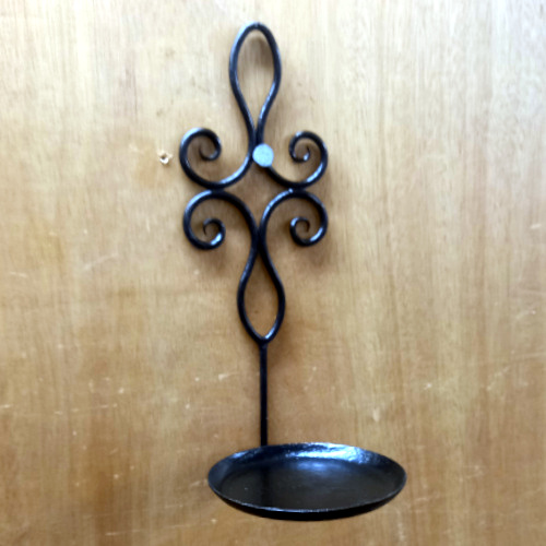 Genuine 1960s wrought iron wall plant holder displaying a potted spider plant