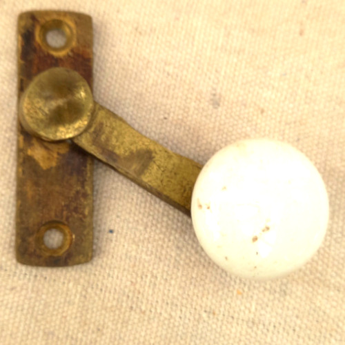Victorian brass and ceramic sash fastener