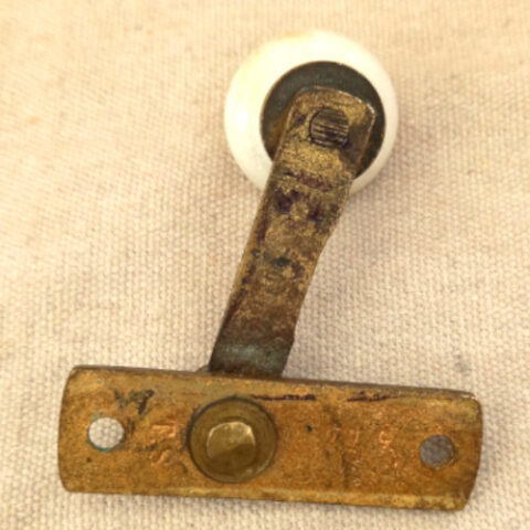 Victorian brass and ceramic sash fastener