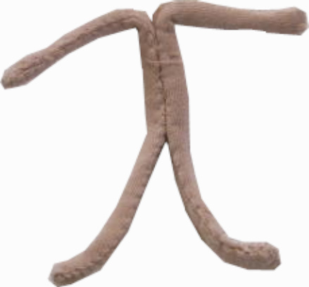 Handmade fabric doll with a stuffed head and body, pipe cleaner arms and legs, and fabric clothes