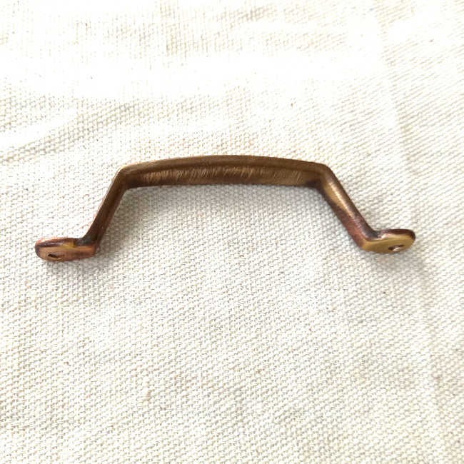 Vintage standard pull handle, possibly brass, with 88mm centre-to-centre spacing