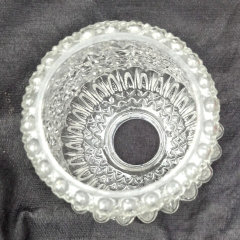 Vintage clear pressed glass tubular lamp shade with raised decorative patterns and ribbed detailing