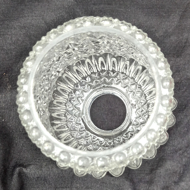 Vintage clear pressed glass tubular lamp shade with raised decorative patterns and ribbed detailing