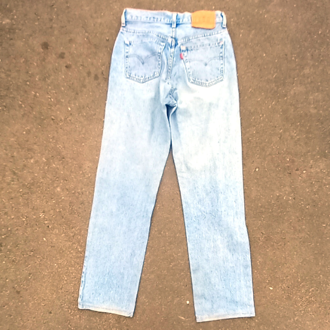 Vintage New Zealand-made Levi’s 555 straight leg jeans with red lowercase e tab and number 10 button stamp