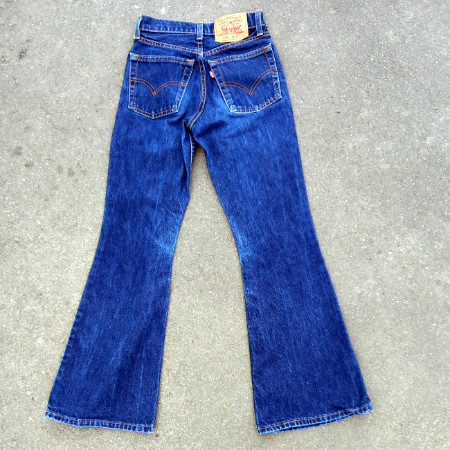 Shop vintage Levi’s 450 flared leg jeans, W25 L30, made in Australia. Classic vintage denim with a distinctive flared silhouette and red Levi’s tab.